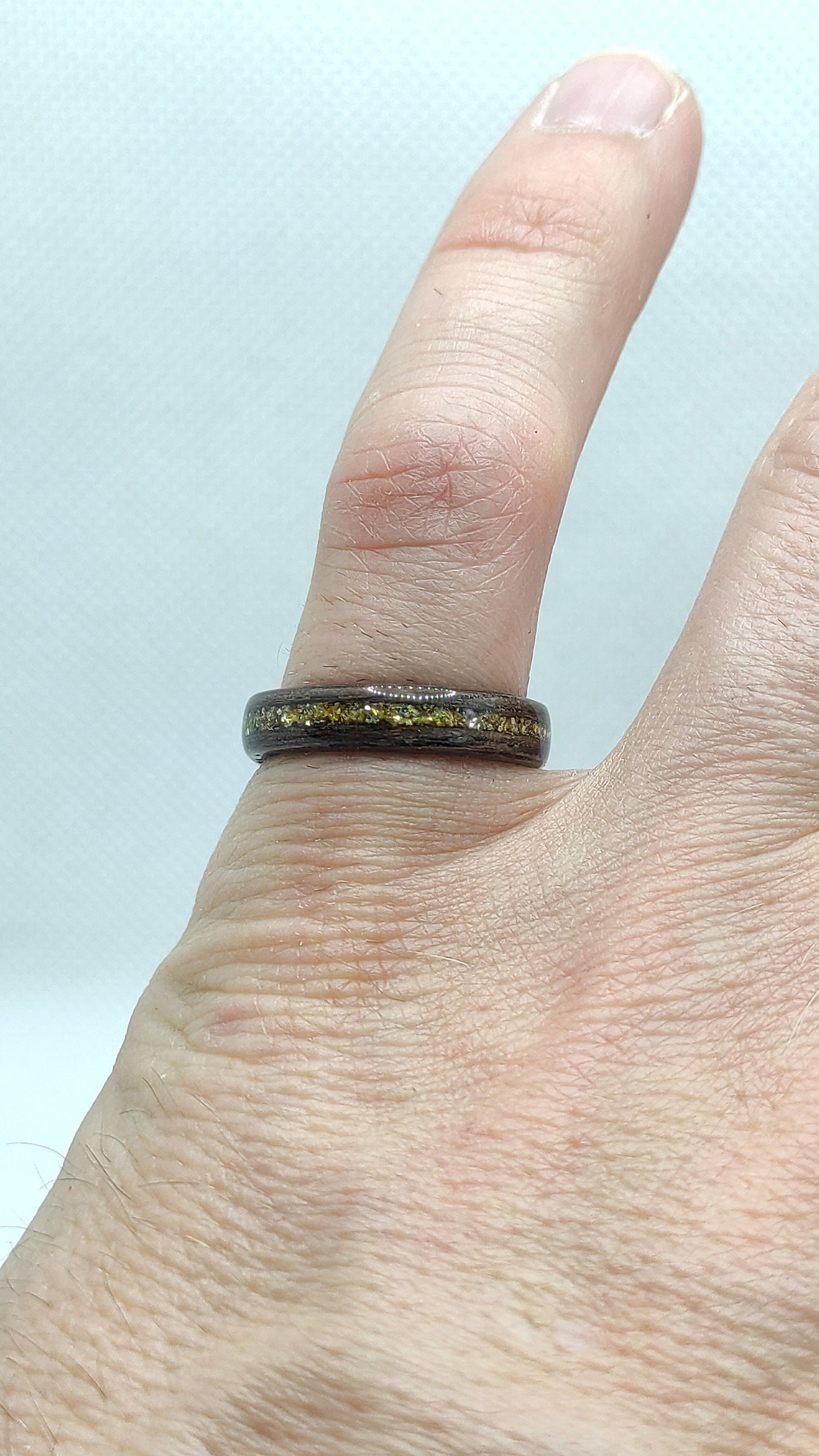Artisan wooden ring with sustainable walnut veneer and gold detail