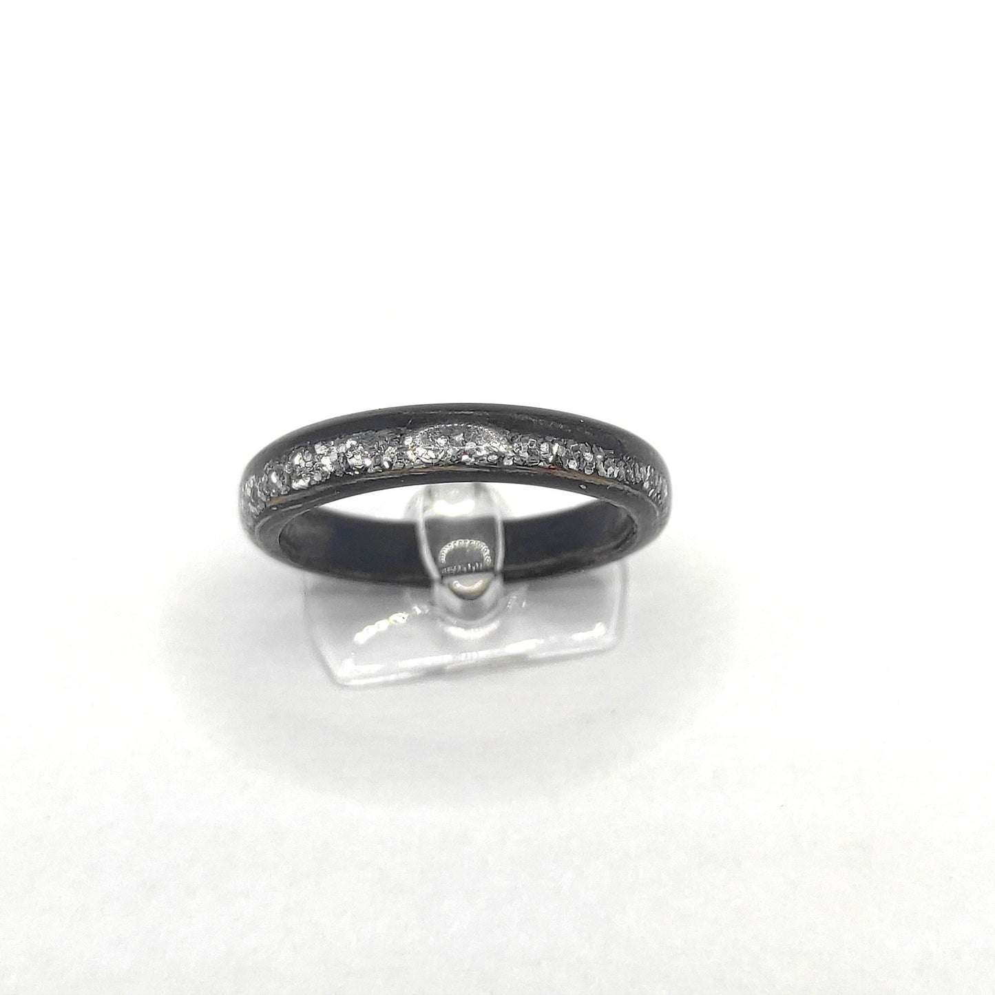 Side profile of eco-friendly ebony wooden ring with shimmering silver inlay”