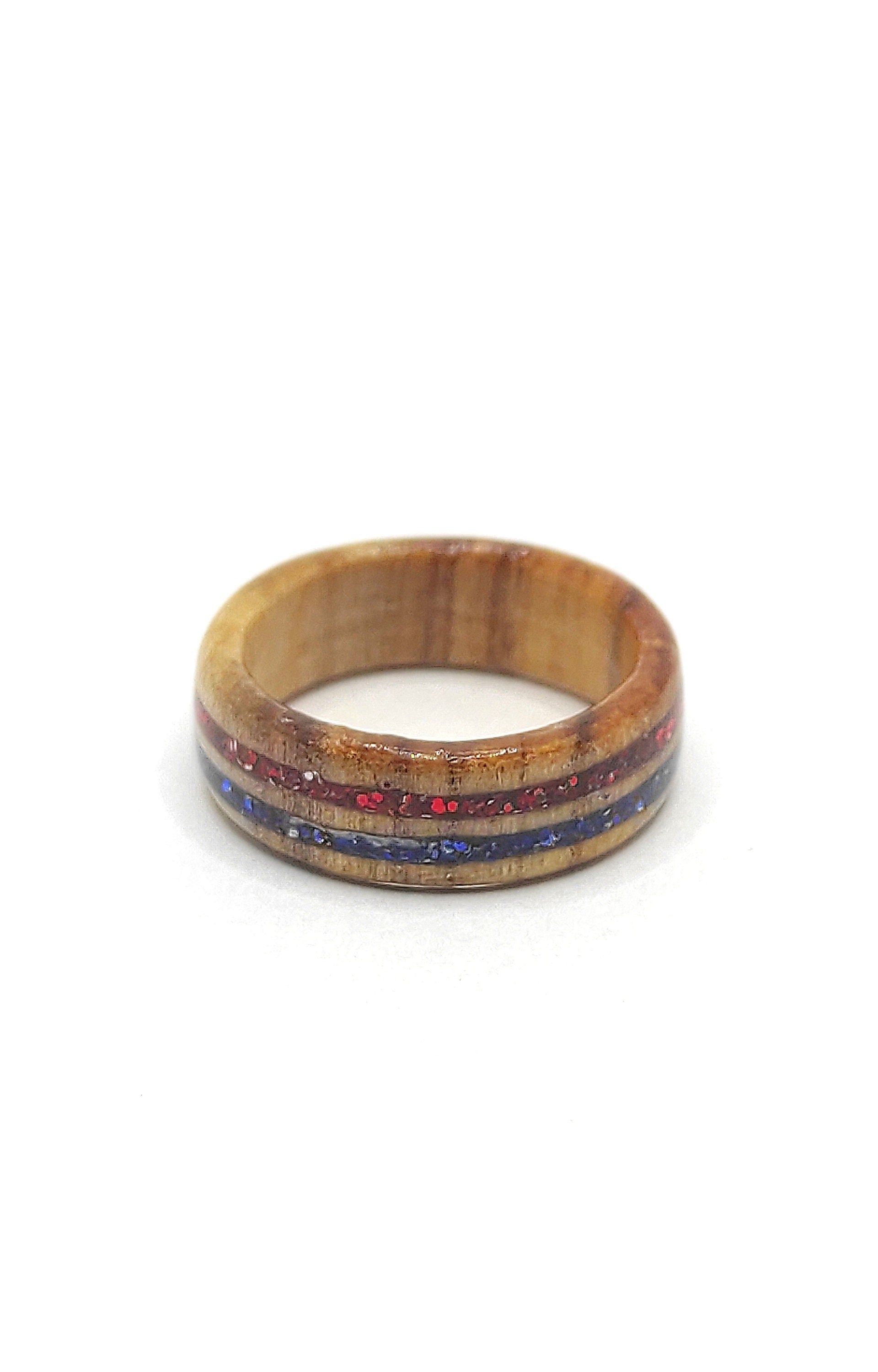 Top view of minimalist wooden ring with dual glitter design