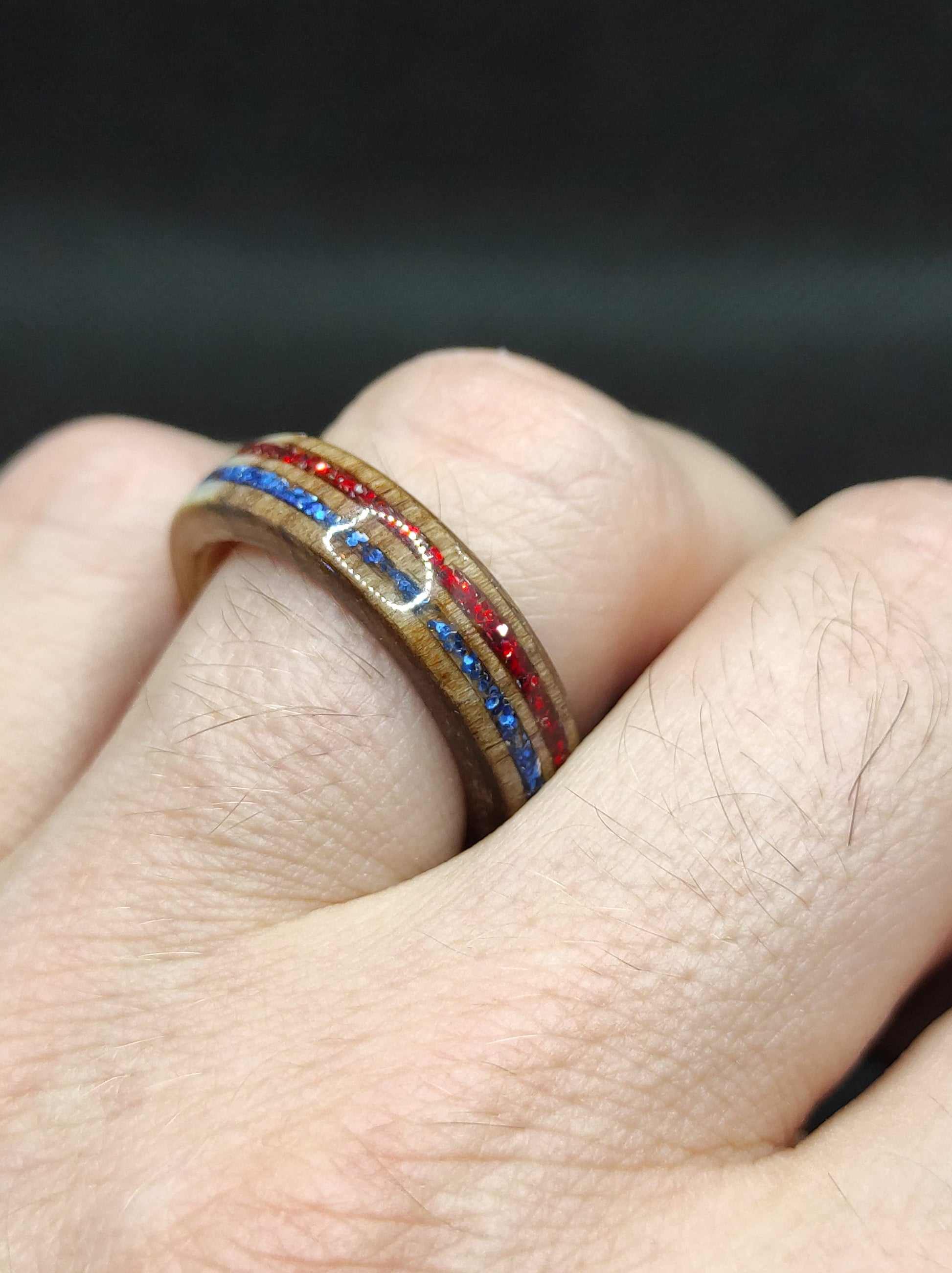 Red and blue glitter inlay sparkling inside handcrafted wooden band