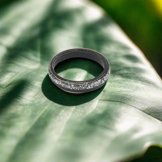Hand-made ebony bentwood ring with silver glitter inlay, front view
