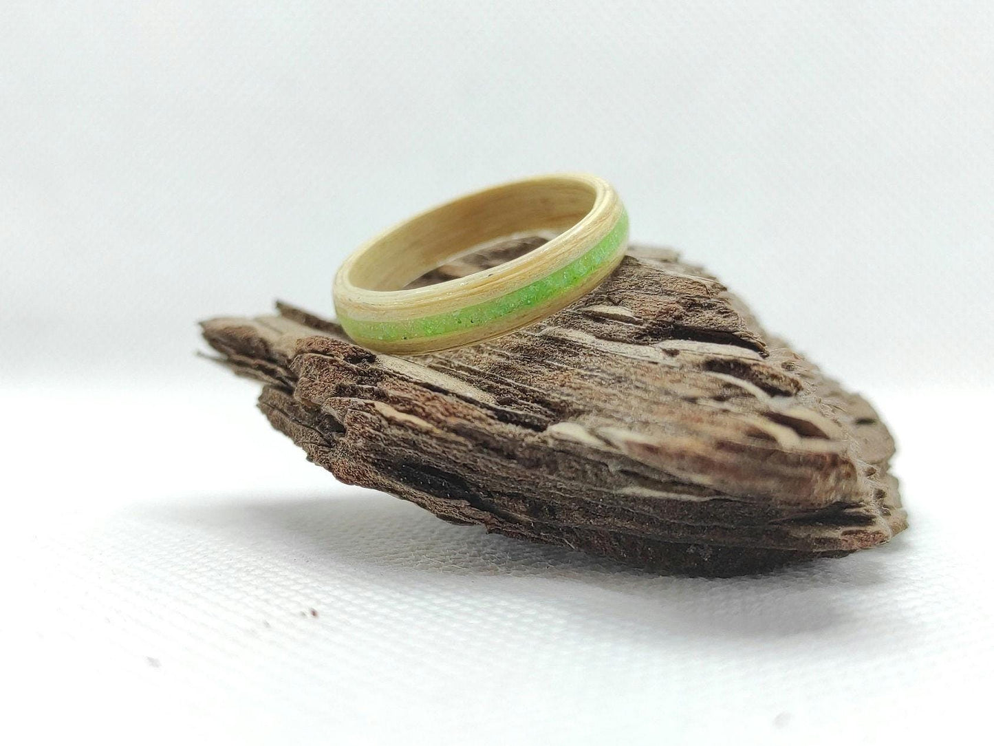 Eco-friendly wooden band with vibrant neon green glitter detail


