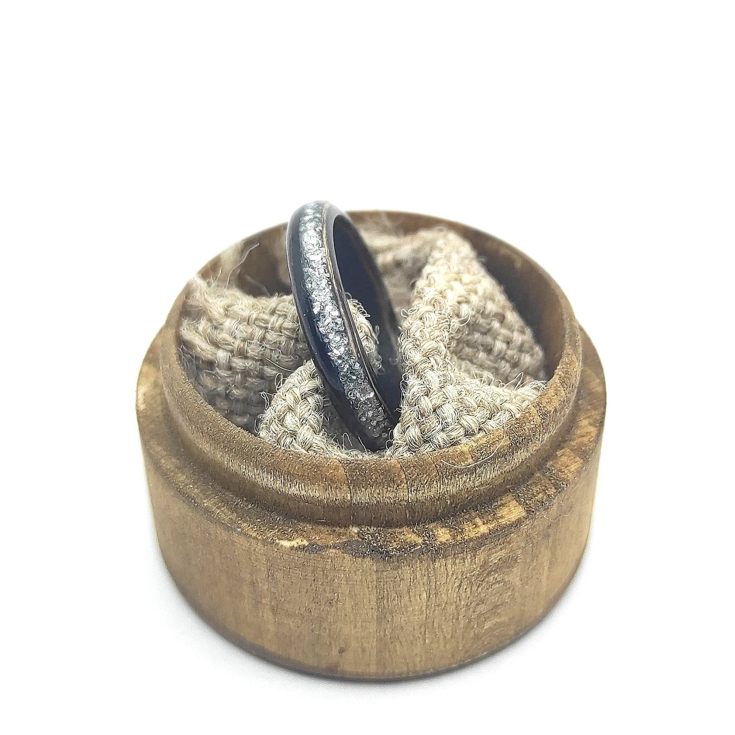 Minimalist ebony bentwood ring with water-resistant finish, shown on neutral background